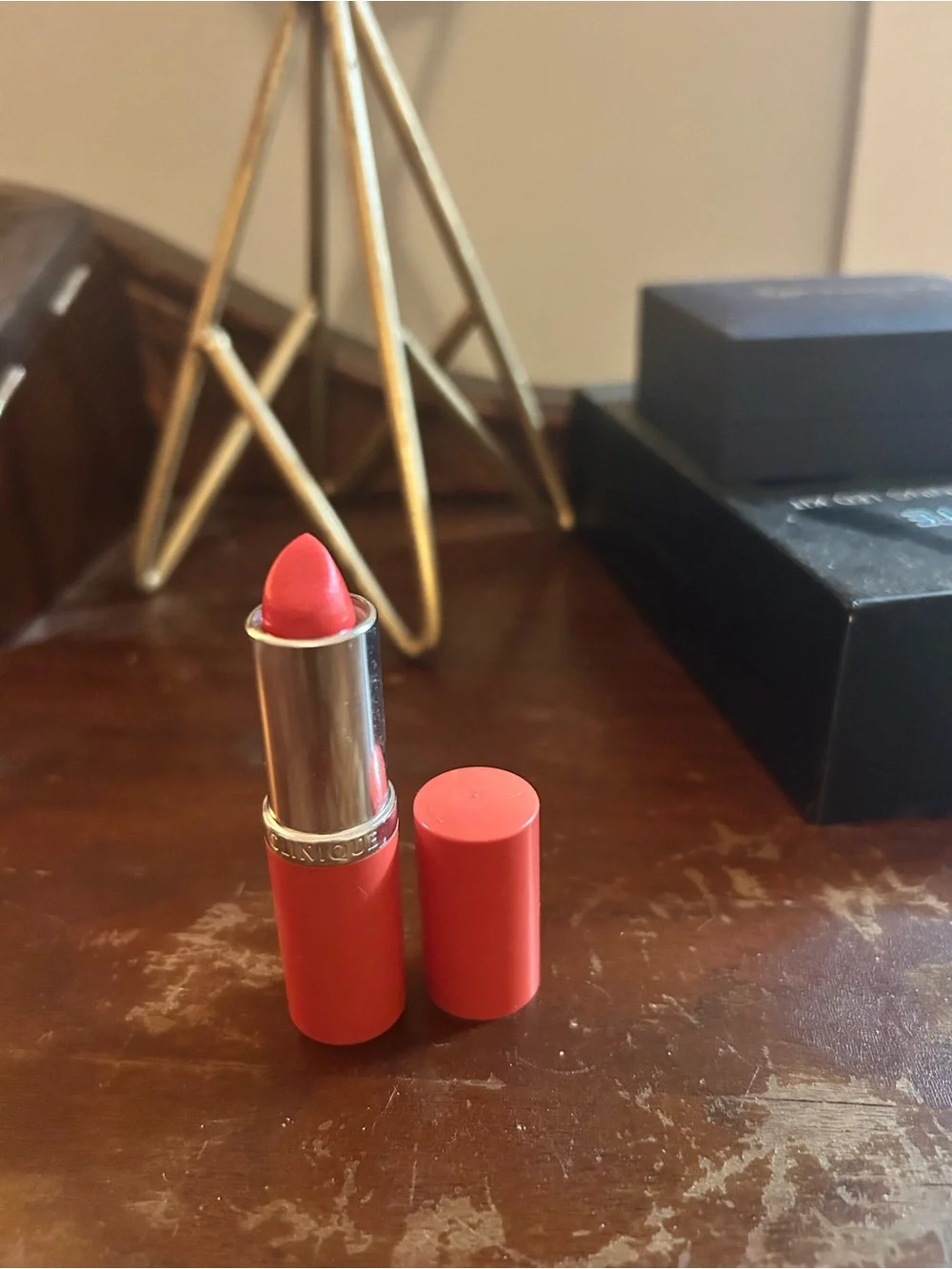 Clinique Satin Lipstick in Coral-Orange Shade. Runaway Coral.